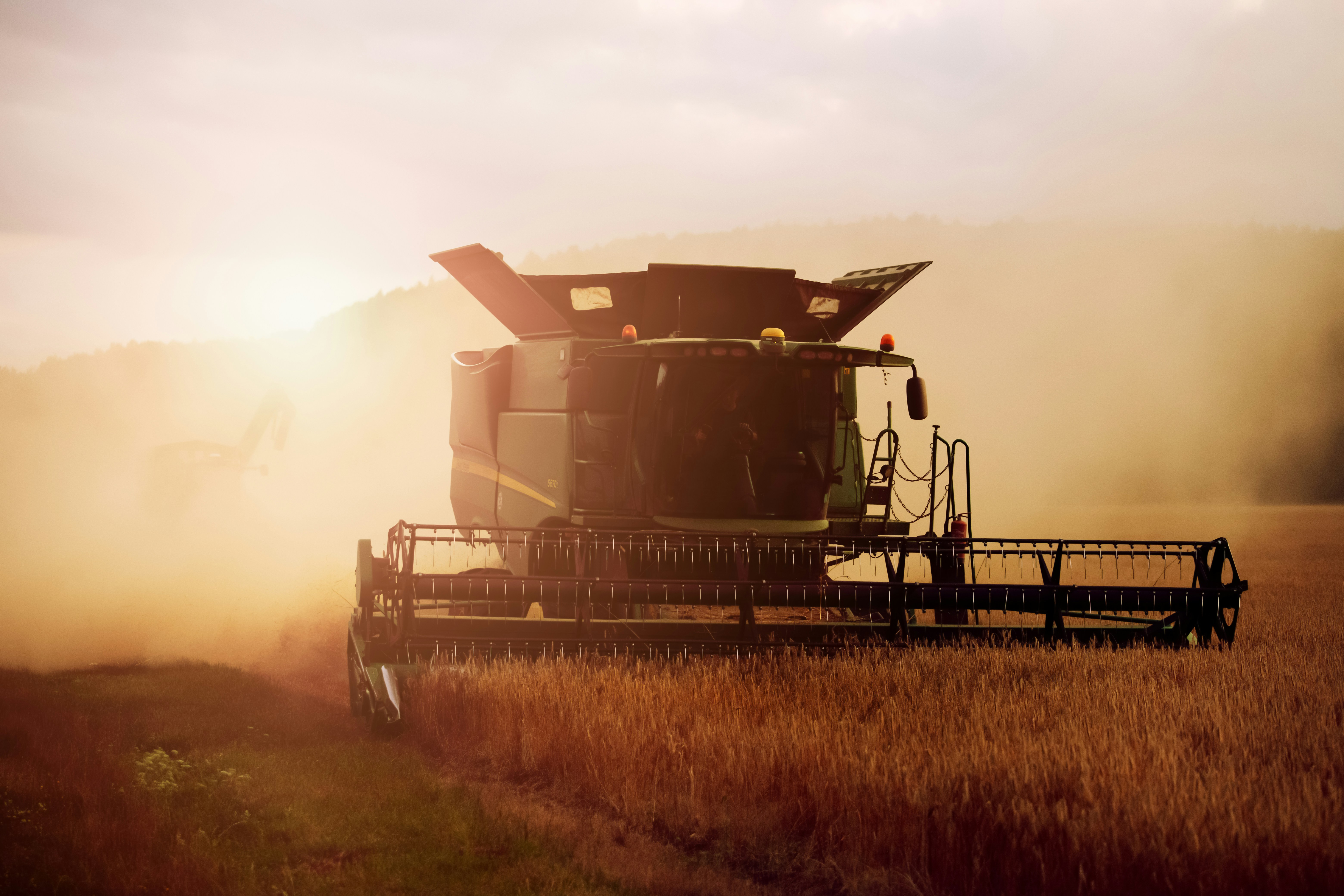 Combine harvester harvesting grain in an agricultural field